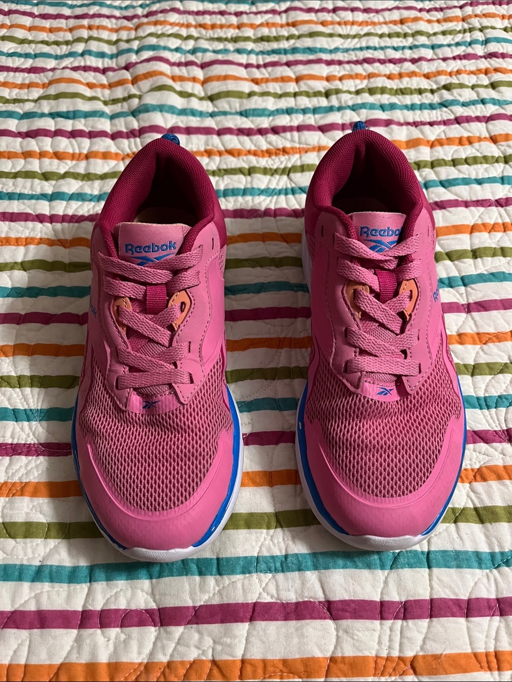 Girls, pink and blue Reebok tennis shoes